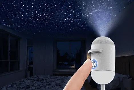 After a second tap the lamp projects stars across the bedroom ceiling